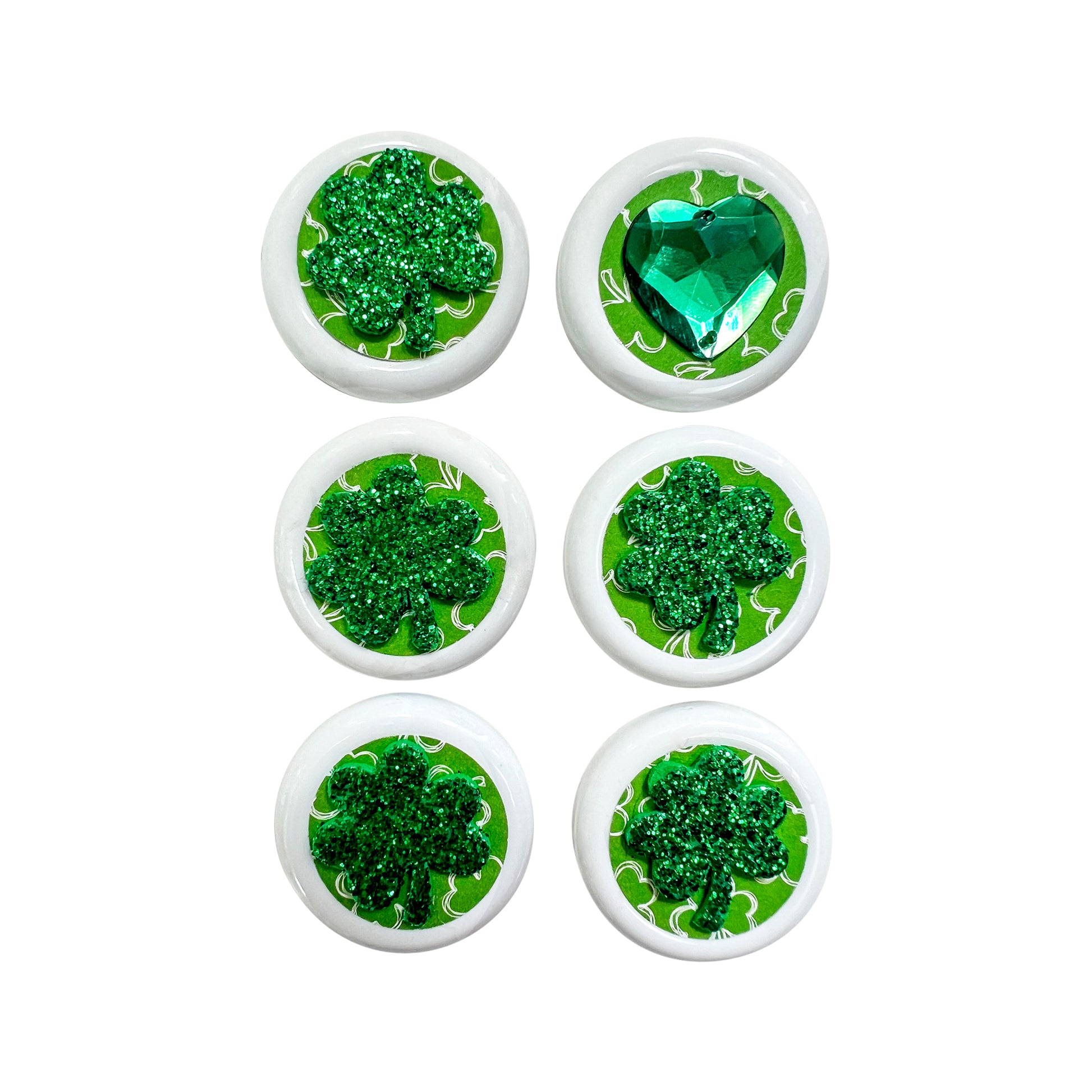 Glass Wrappings' set of 6 white button embellishments, 5 topped with green glitter shamrocks, and 1 with a green gem heart.