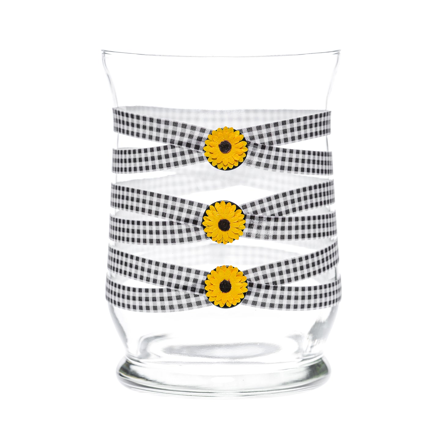 Front of Glass Wrappings 8” hurricane vase wrapped in black & white check elastic, decorated with 3 sunflowers .
