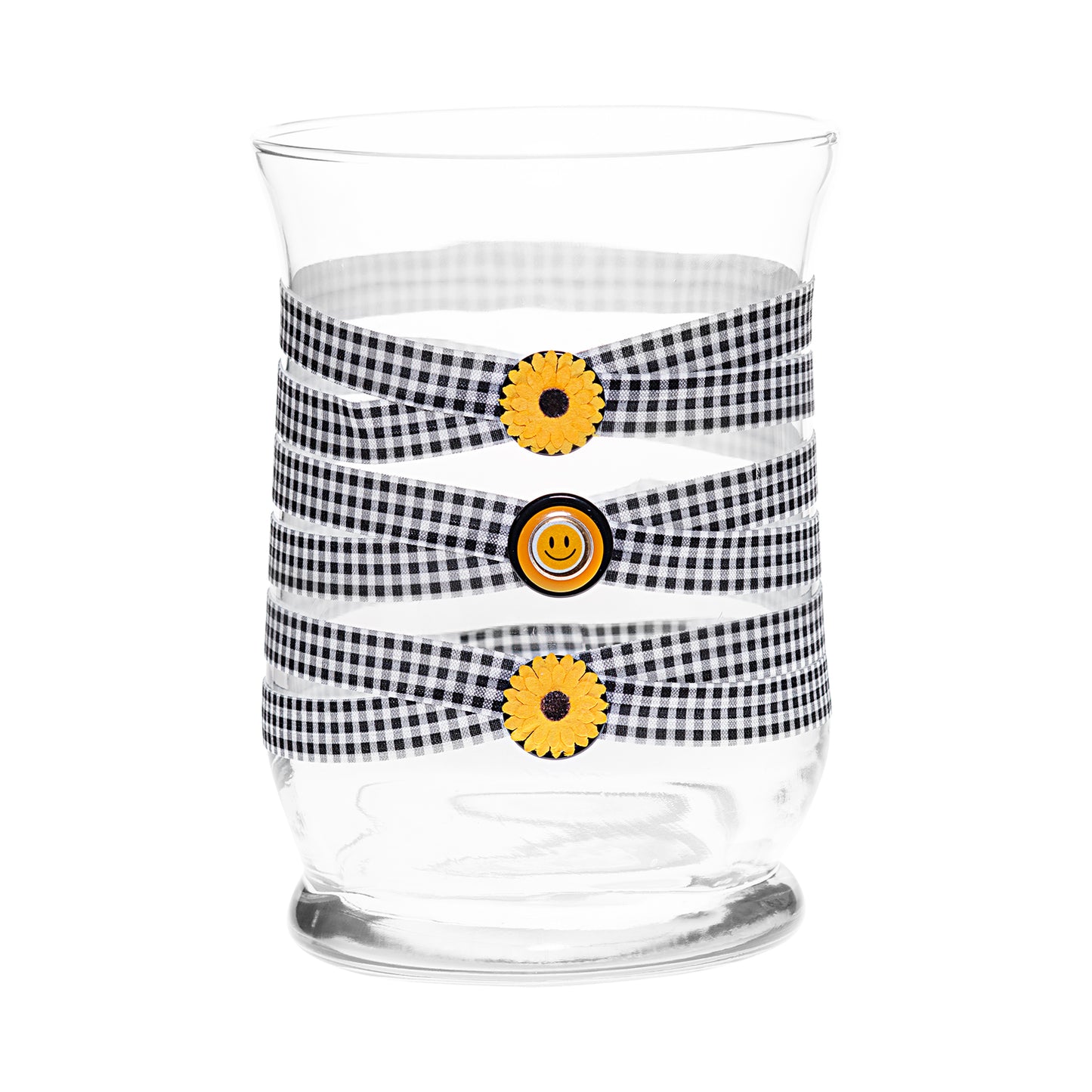 Front of Glass Wrappings 8” hurricane vase wrapped in black & white check elastic, decorated with 2 sunflowers and a gold smiley face.