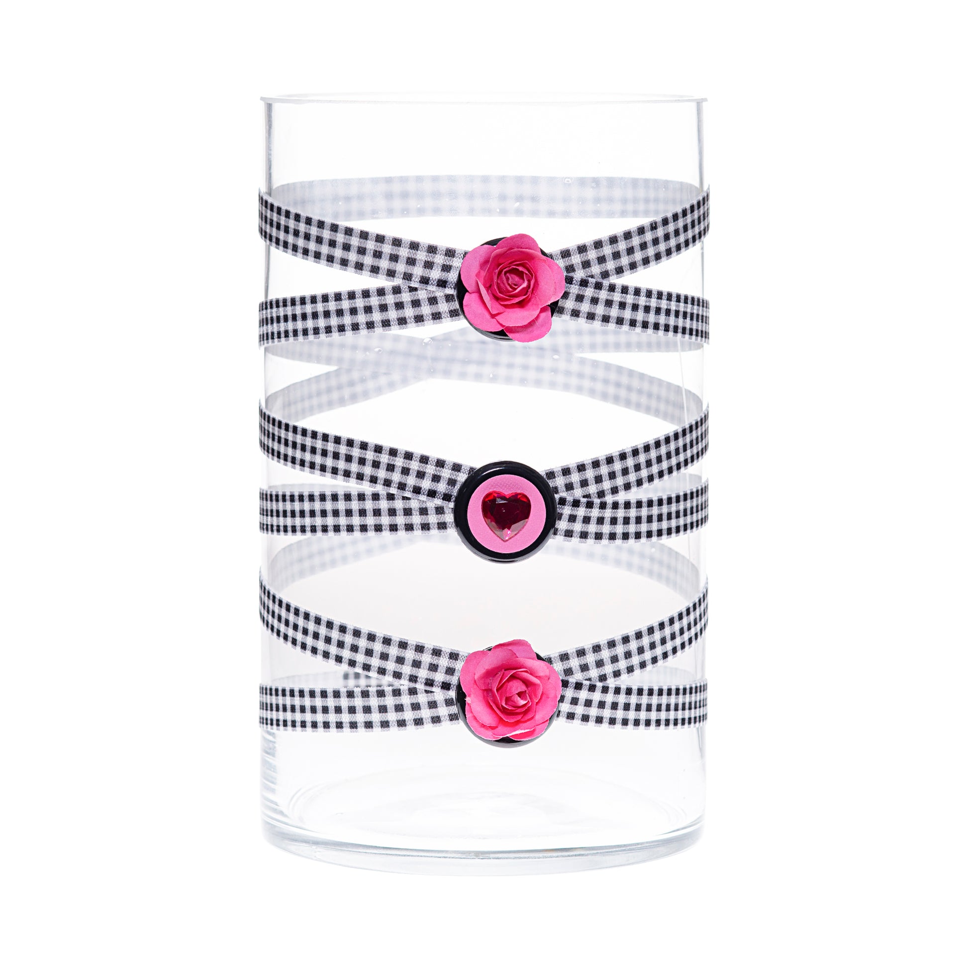 Front of Glass Wrappings 6" x 10" cylinder wrapped in black & white check elastic, decorated with 2 pink daisies and 1 pink gem heart.