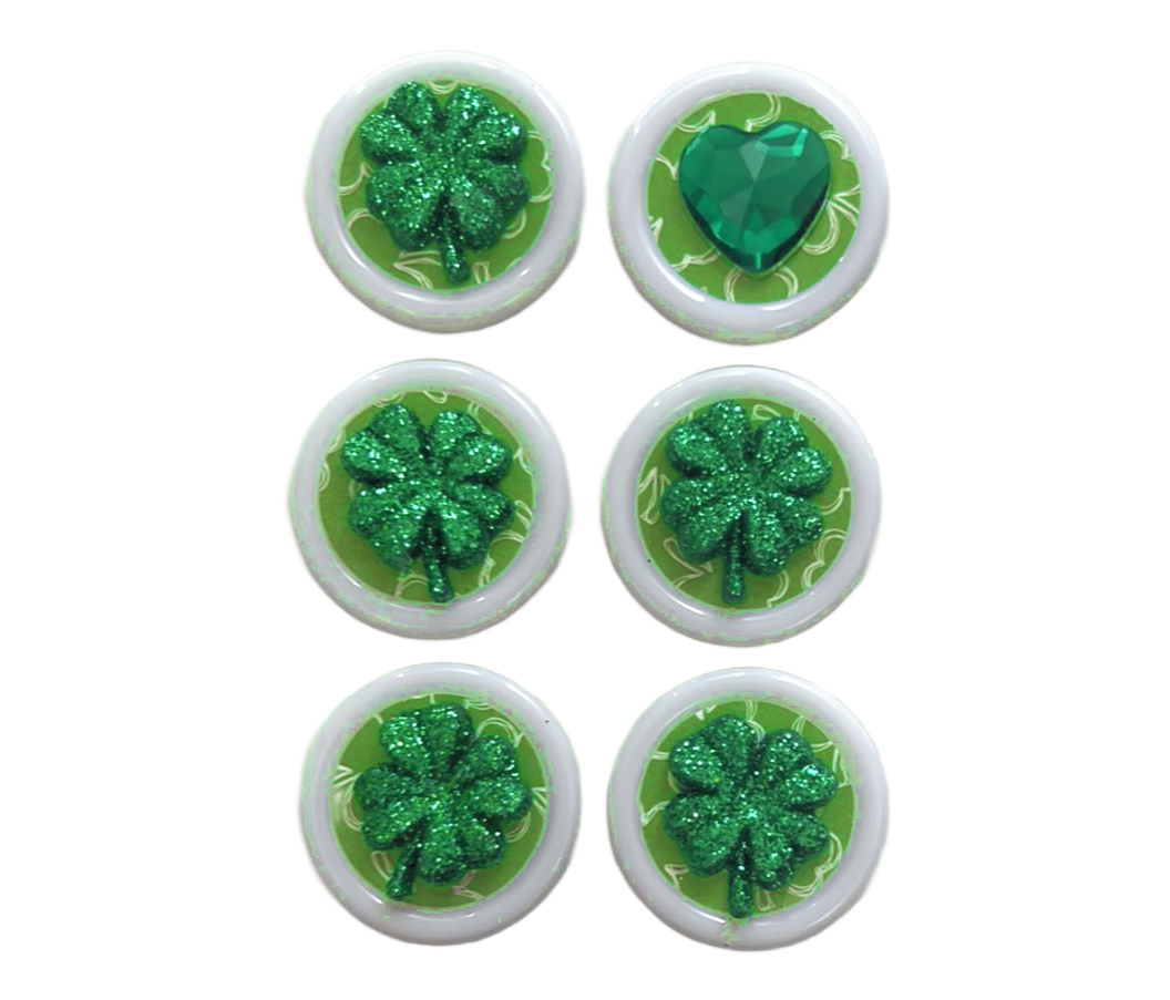 Glass Wrappings set of 6 Green Shamrocks + Heart embellishments. 5 glitter shamrocks and 1 gem heart sit atop white buttons.