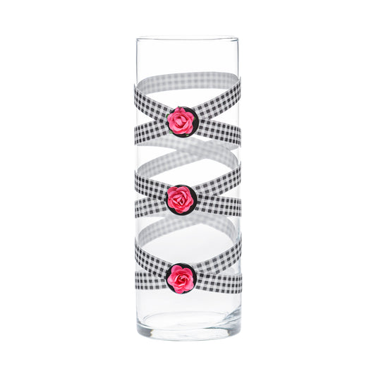 Front of Glass Wrappings 10" bud vase wrapped in black & white check elastic, decorated with 3 pink roses.