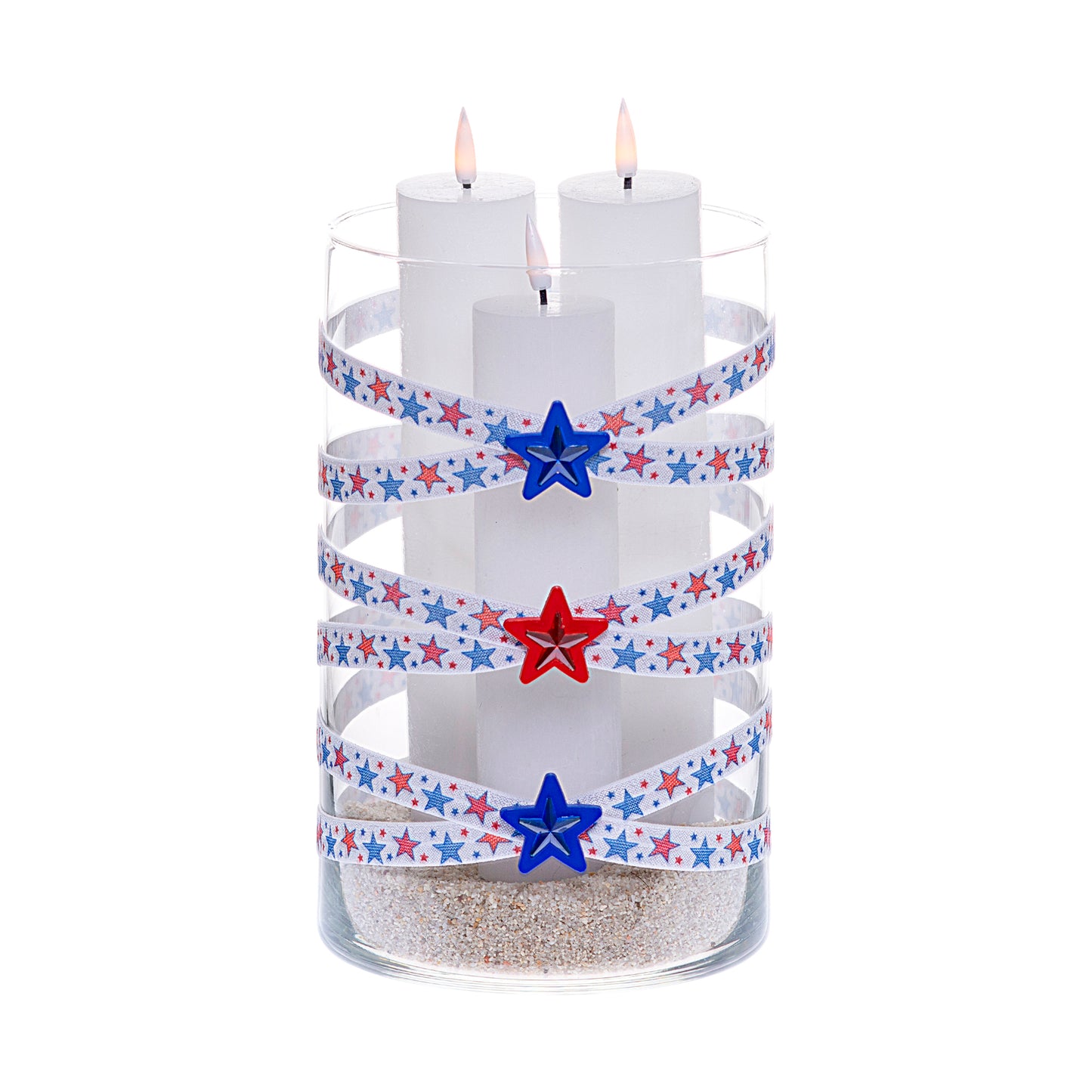 Front of Glass Wrappings 6" x 10" cylinder wrapped in white elastic with red and blue stars, adorned with red and blue gem stars on 1-1/2" red and blue star buttons.  It is filled with 3 white candles.